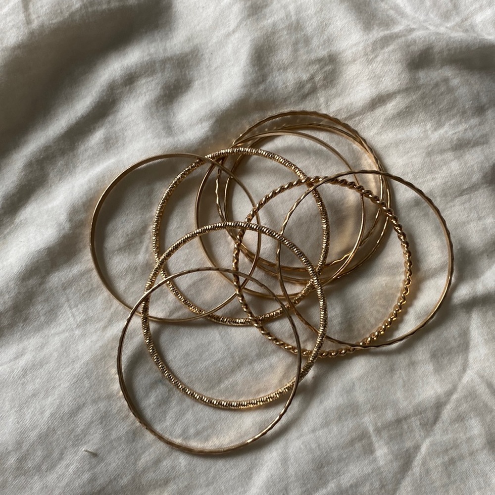 nine gold bangle bracelets